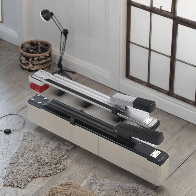 A mini paper binding machine is on the floor.