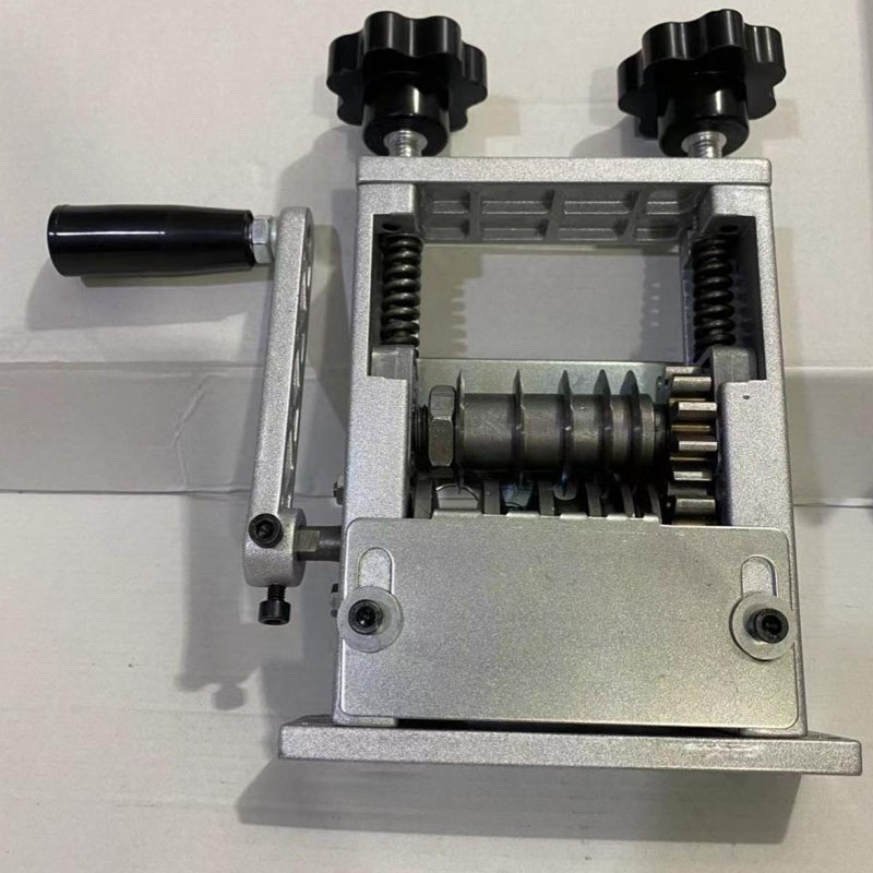 Manual wire stripping machine processing various sizes of scrap electric wire.