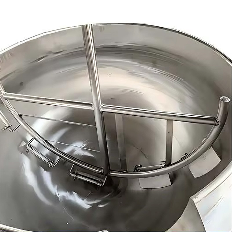 Details inside the pot of an industrial heating mixer.