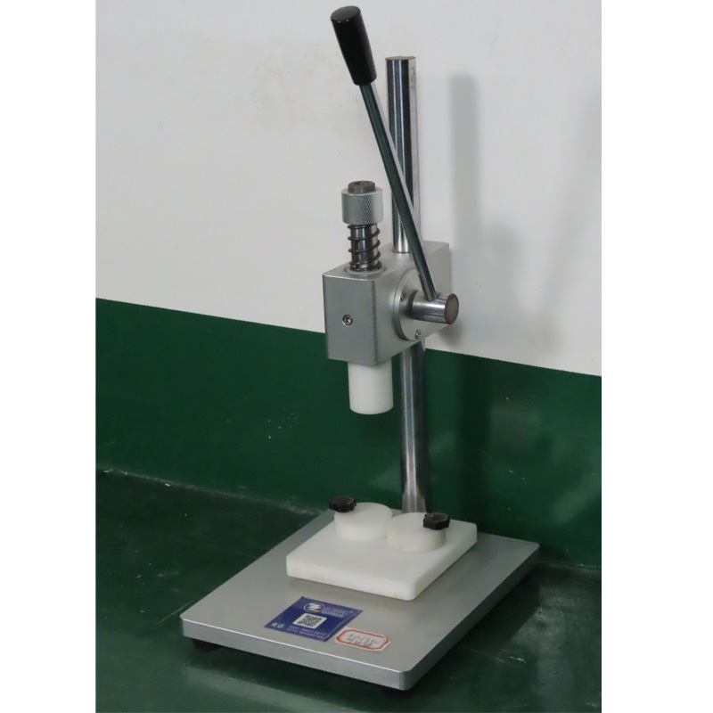 Movable wooden base supporting compact capping machine.