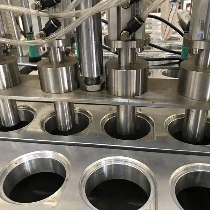 Cup filling and sealing machine for beverage production