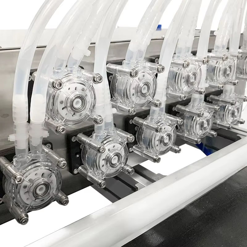 Multi head liquid filler for small bottle production